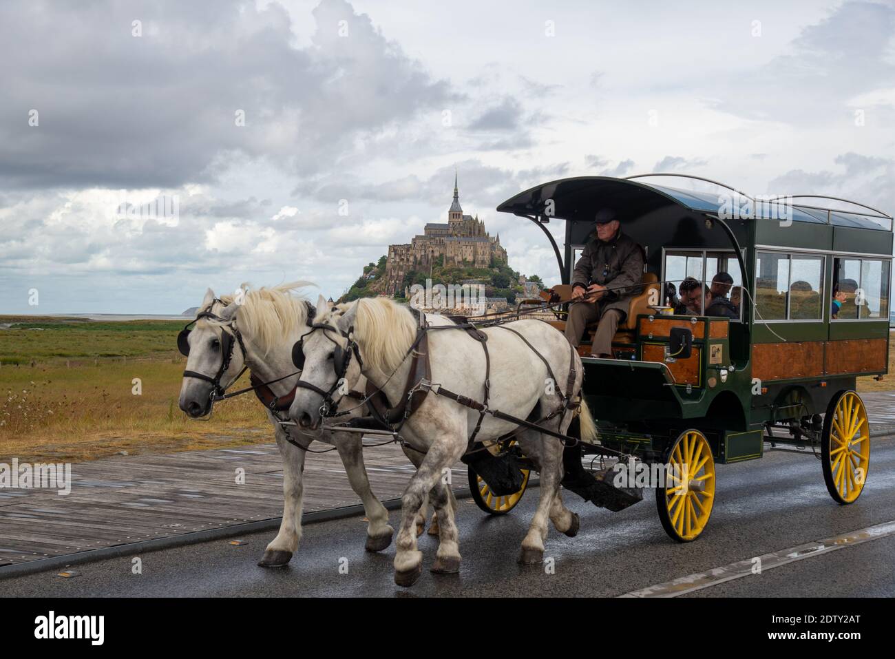 horse cart with visitors at Mont St. Michel in Bretagne, France Stock Photo