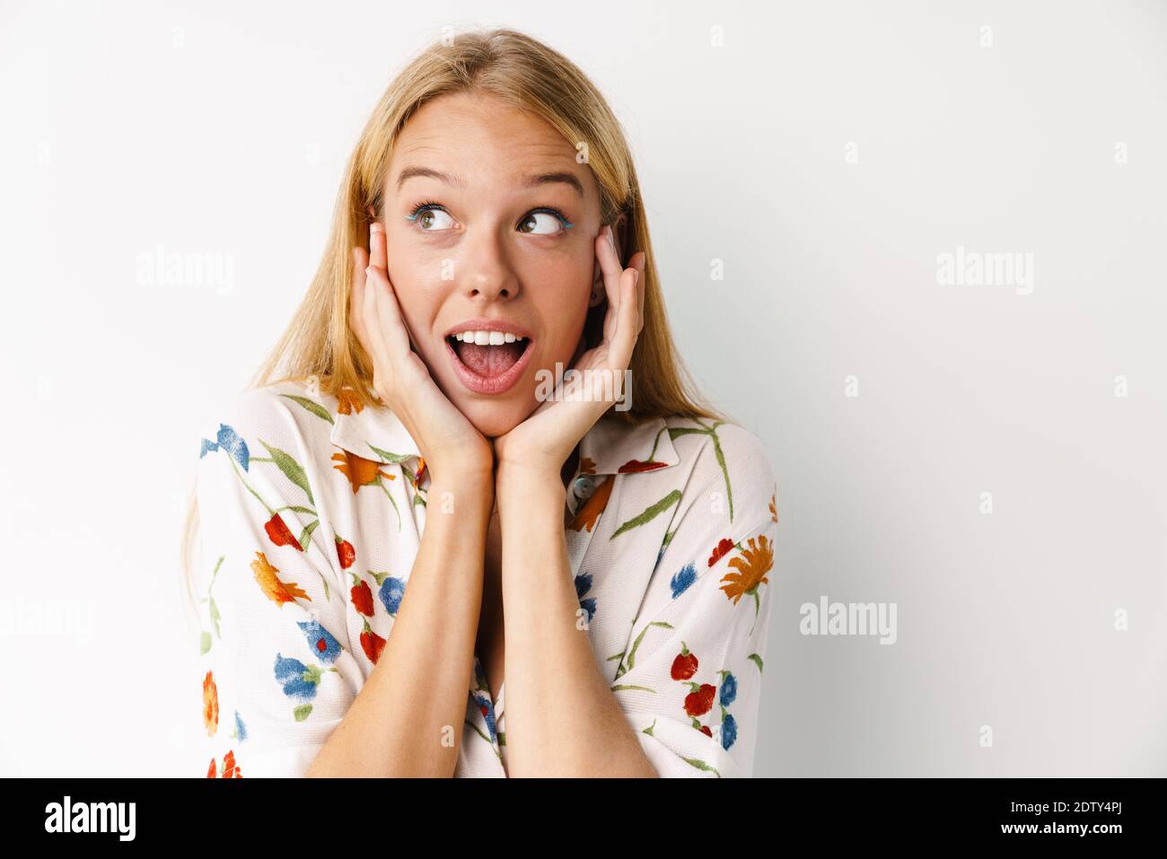 Excited beautiful girl expressing surprise at camera isolated over ...