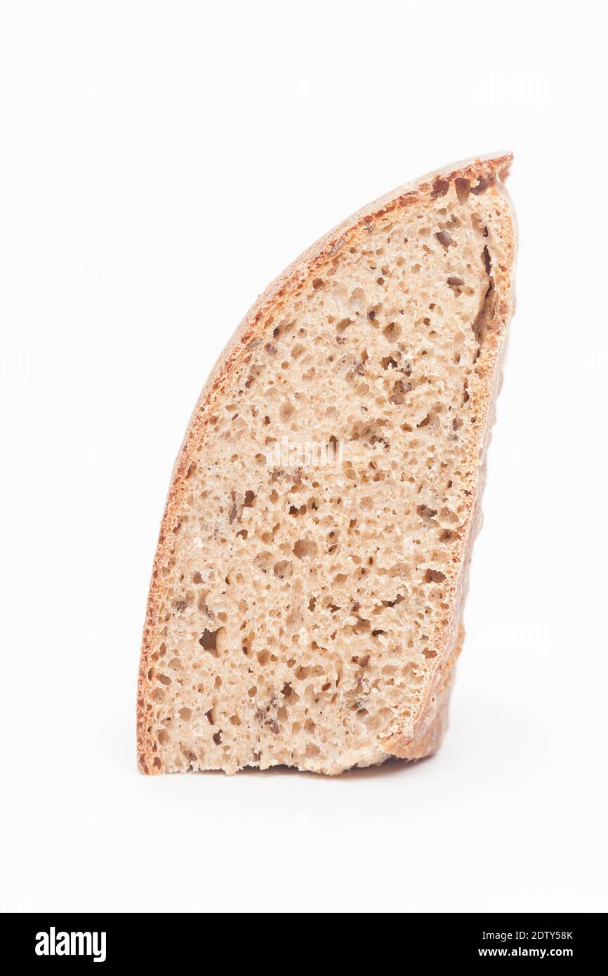 Piece of wholewheat bread loaf against white background Stock Photo - Alamy
