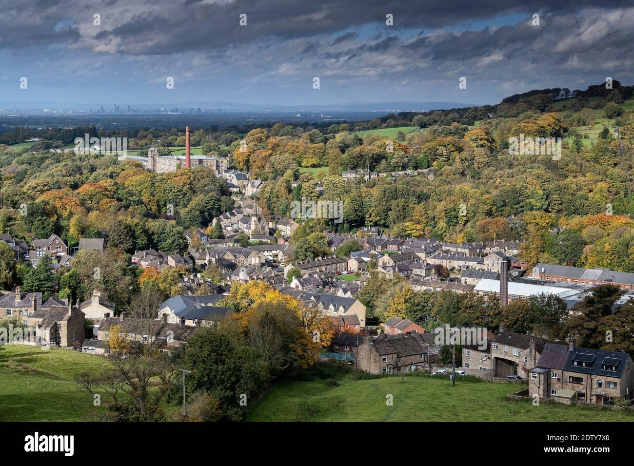 Clarence Mill, Bollington and distant city of Manchester in autmn, Bollington, Cheshire, England, UK Stock Photo