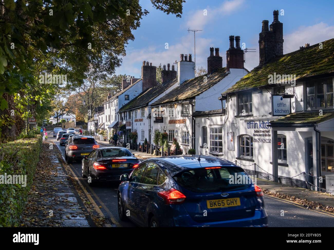 Busy Traffic in Prestbury Village in autumn, Prestbury, Cheshire, England, UK Stock Photo