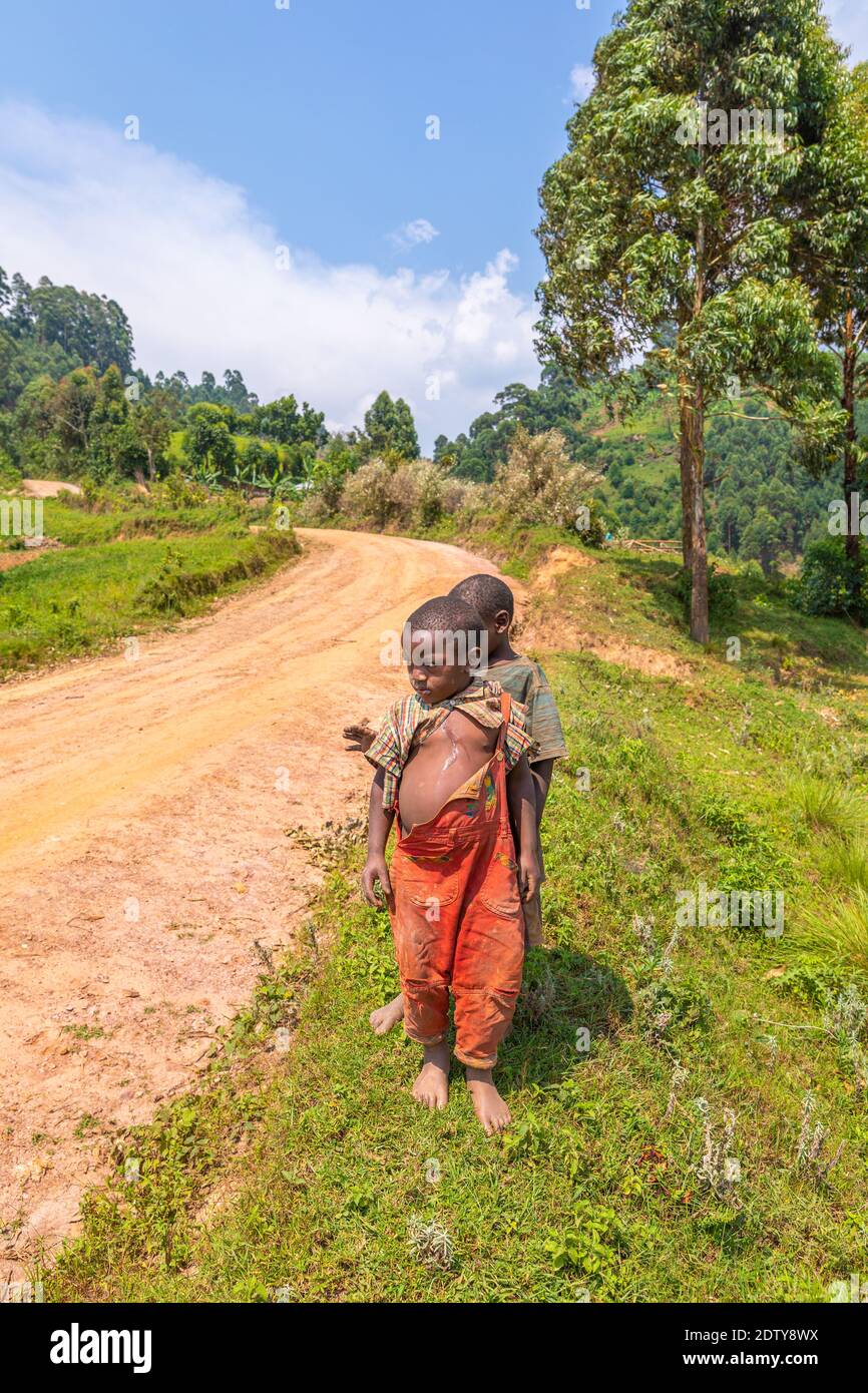 Kids in old ragged clothes in a rural area, Lake Mutanda, Uganda Stock ...