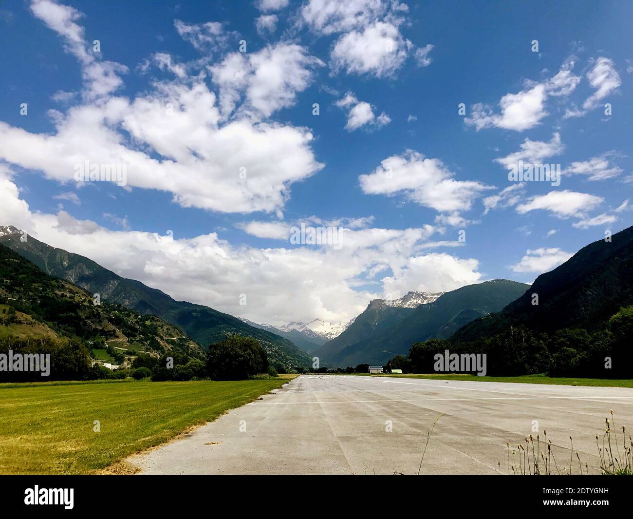 Road Leading Towards Mountains Against Sky Stock Photo