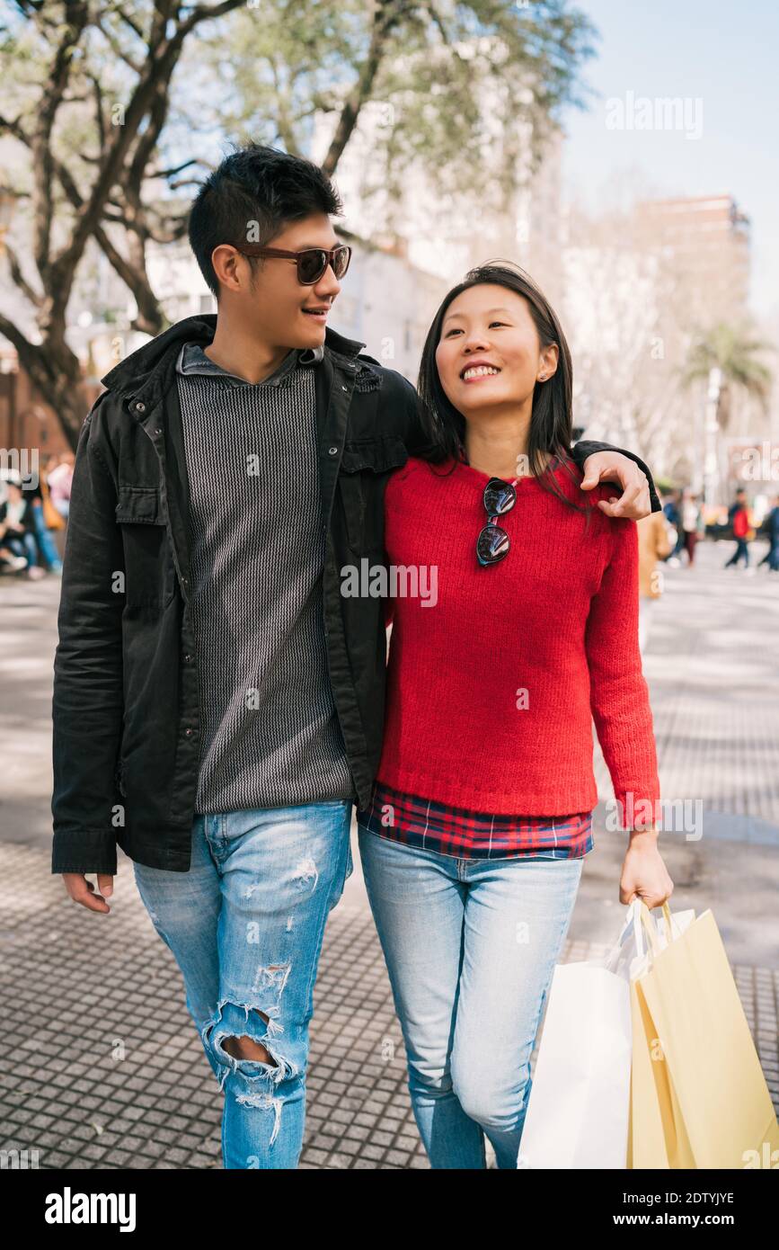 Happy two shopaholic asian hi-res stock photography and images - Alamy