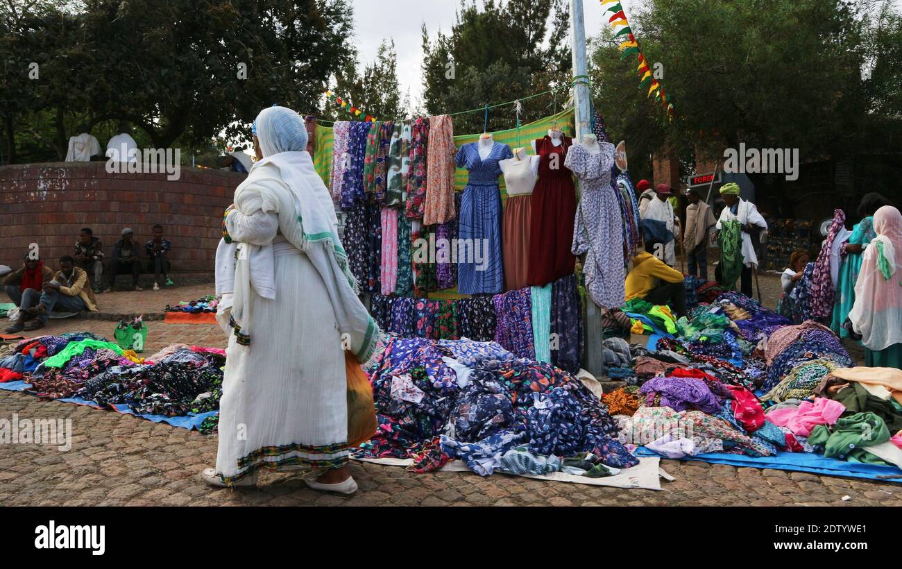 Lalibela-Ethiopia: April 12, 2019: Street market in Lalibela with people in traditional white shoals Stock Photo