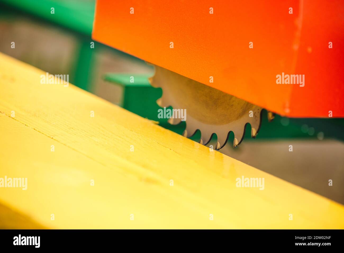 wood cutting machine. Close up electric circular saw cutting wood and