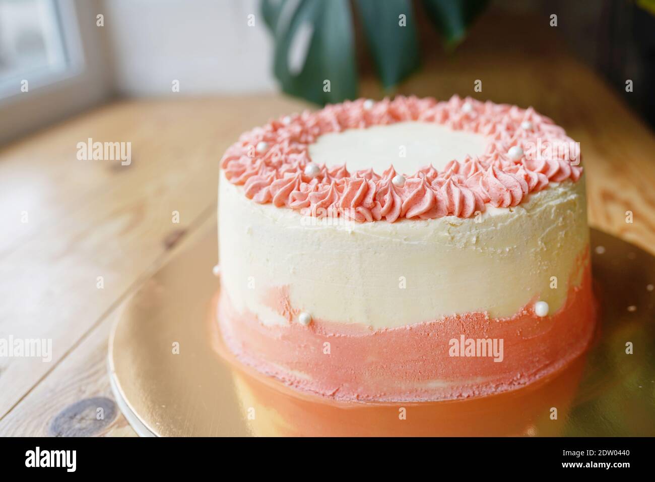 Simple white and pink color wedding or birthday cake Stock Photo ...