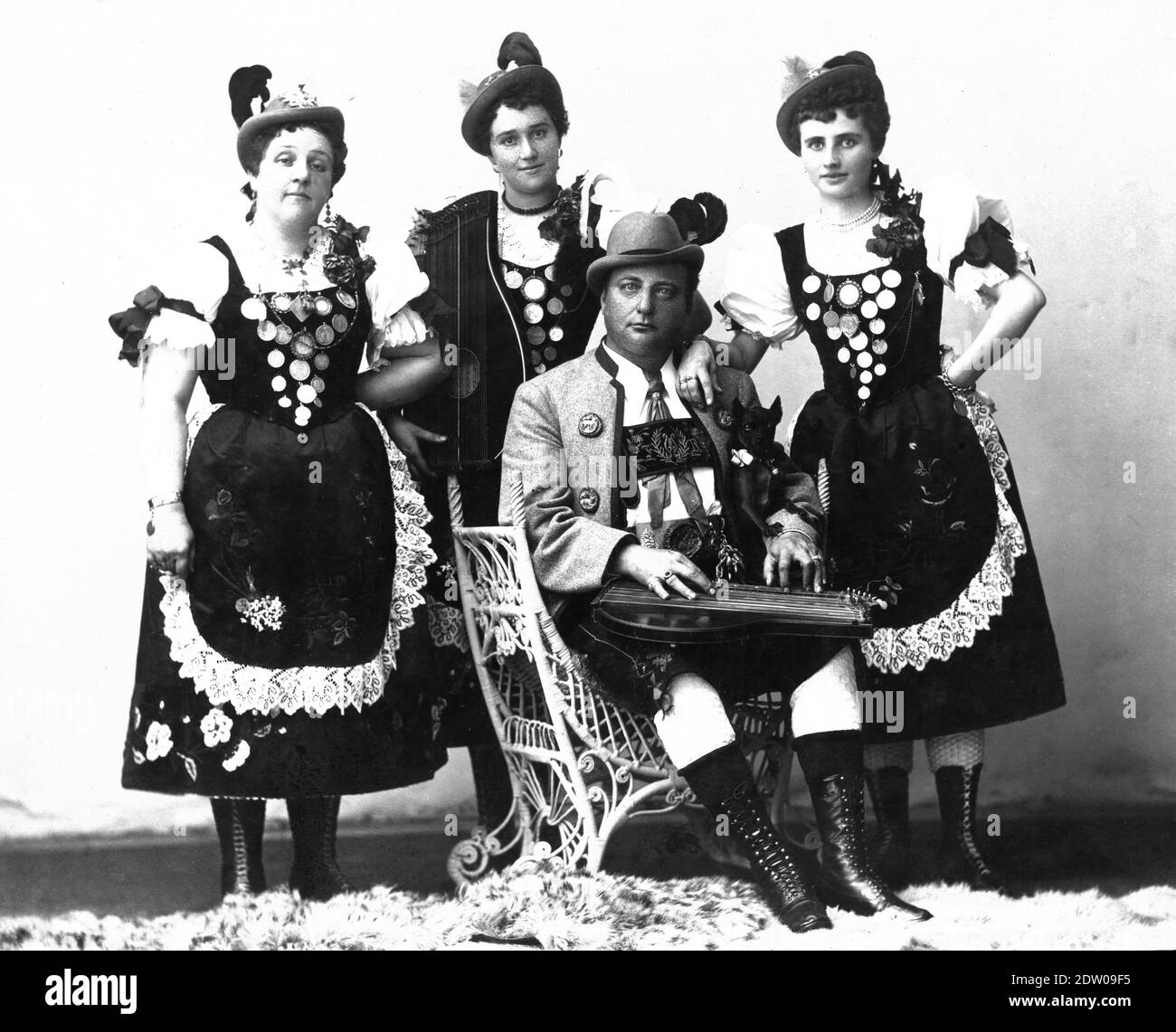 'Franz Reilhofer's Alpine Yodlers' circa 1885, in Chicago, Illinois, USA. Franz's group, under various names, traveled extensively playing and singing in their Tyrolean costumes. They played vaudeville and all sorts of local events such as music shows, town celebrations, etc.  Similarly as did many circus performers, this musical group carried lots of photos to be sold to audience members to supplement their performance income. This photo is on a cream-colored cabinet card.  To see my other music-related images, Search:  Prestor  vintage  music Stock Photo