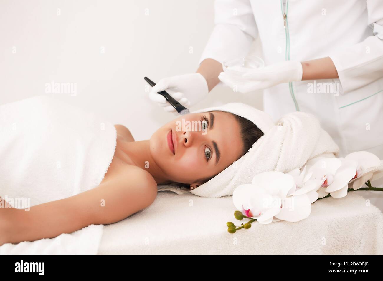 The concept of health, beauty, spa and leisure - beautiful woman and spa receiving massage. Stock Photo