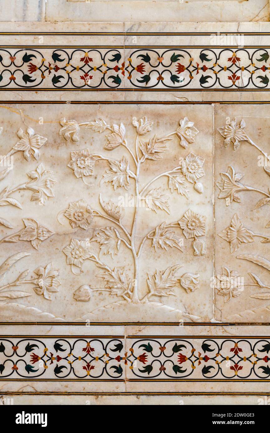 Decorative details of plant motifs and pietra dura inlay on a wall of ...