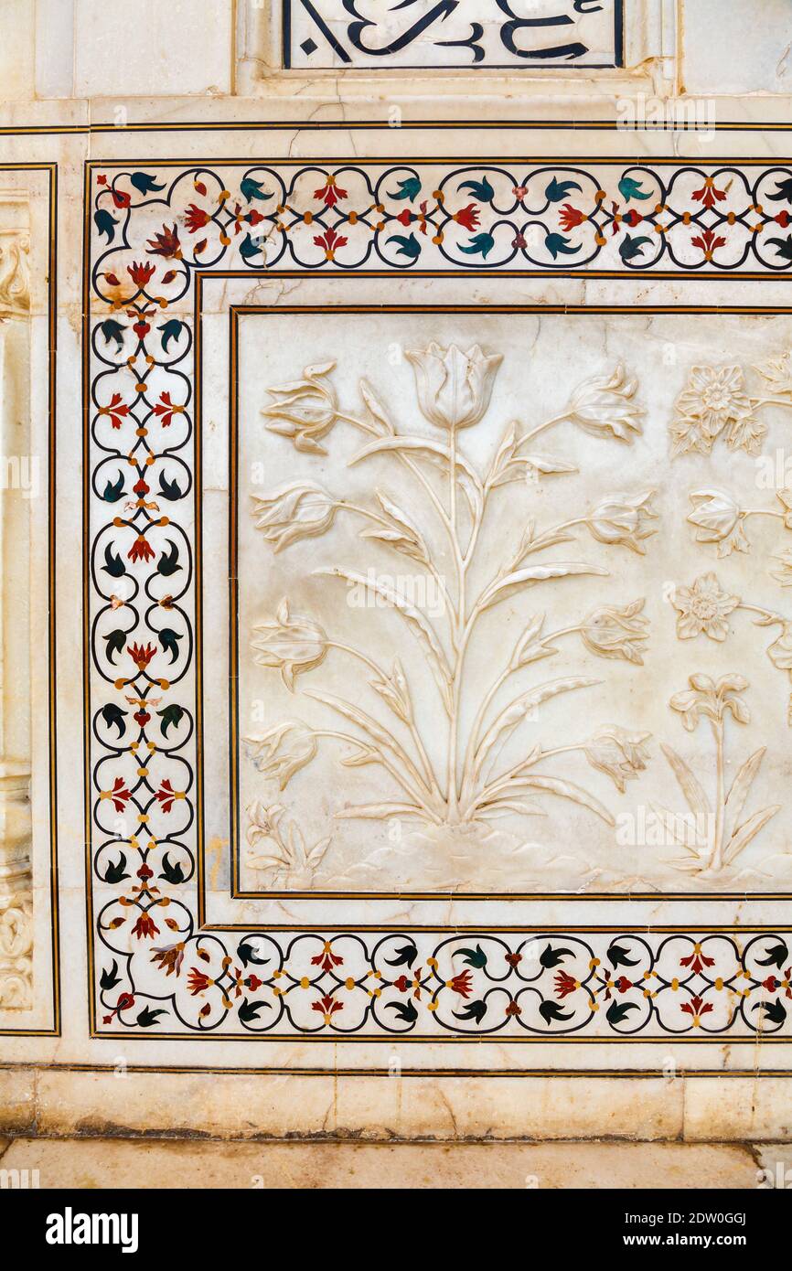 Decorative details of plant motifs and pietra dura inlay on a wall of ...