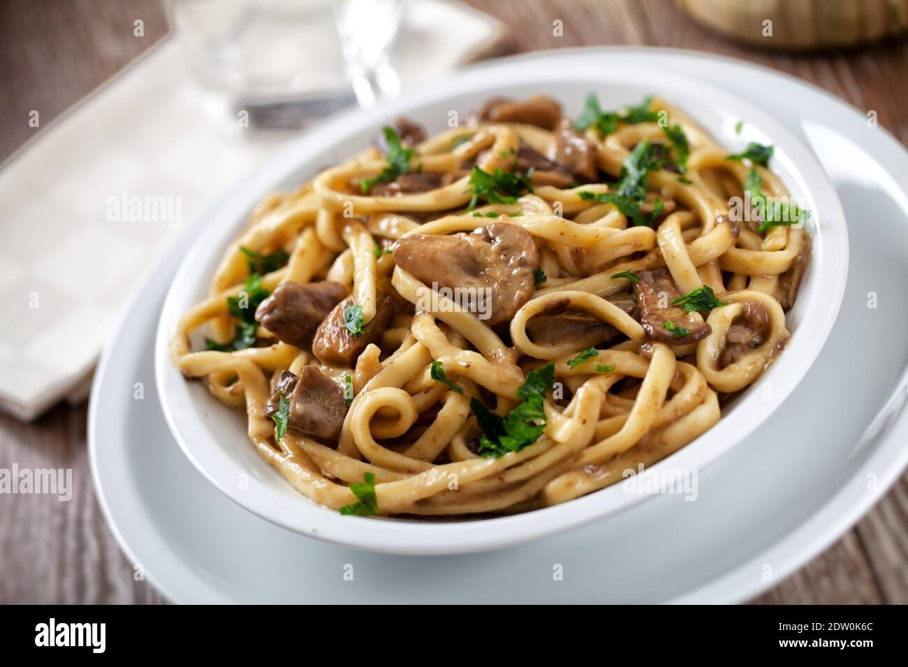 Tagliatelle with mushrooms on a plate. High quality photo. Stock Photo