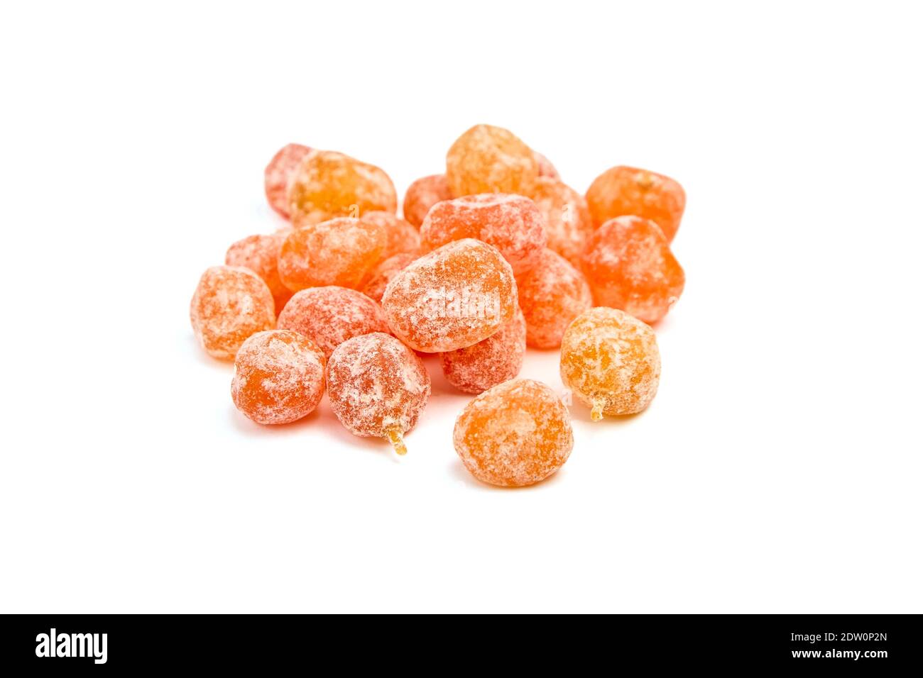 Candied fruits, heap of dried kumquats isolated on white background. Sugar coated kumquats Stock