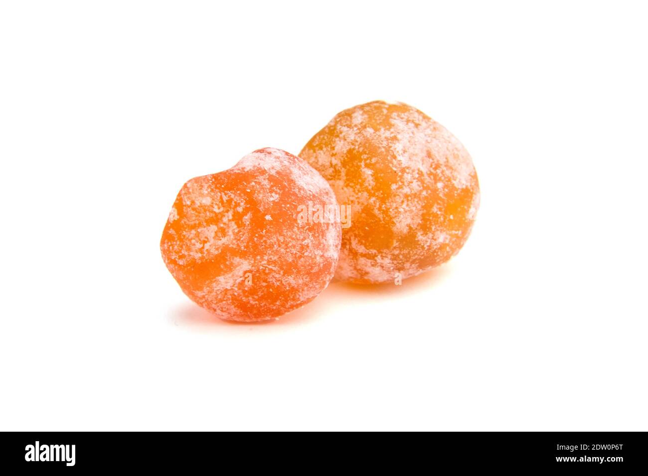 Dried kumquats, two candied fruits isolated on white background. Sugar
