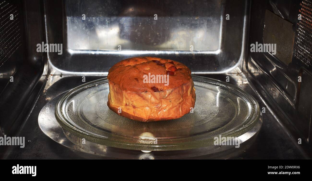 Baking a Fruit Cake inside an oven for Christmas celebration Stock