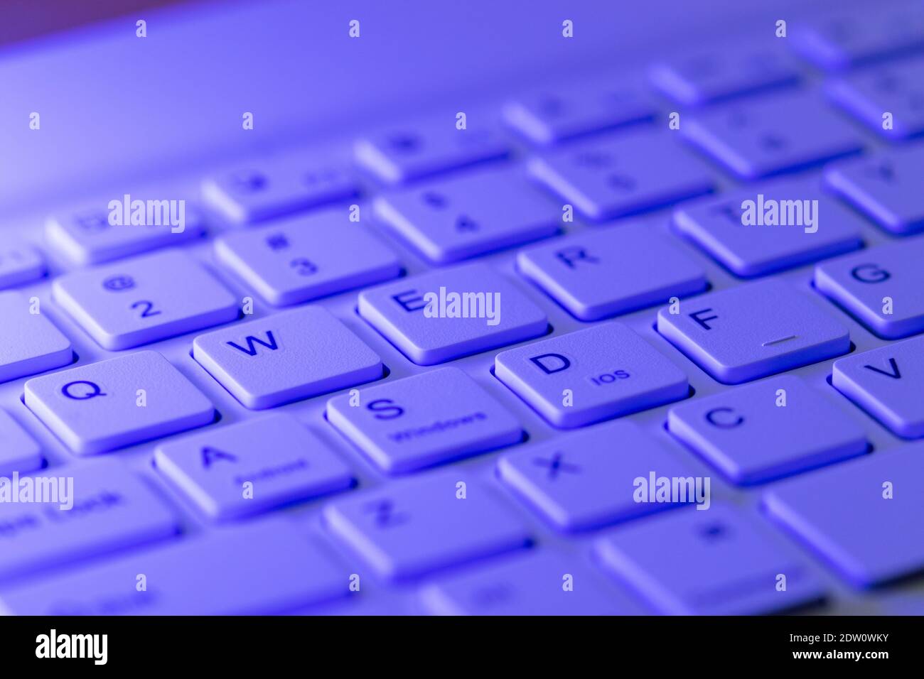 Blue highlighted qwerty keys on a computer keyboard Stock Photo
