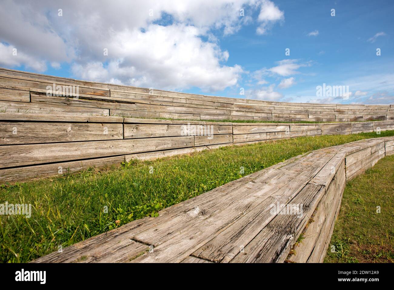 Wooden bleachers with public park space Stock Photo Alamy