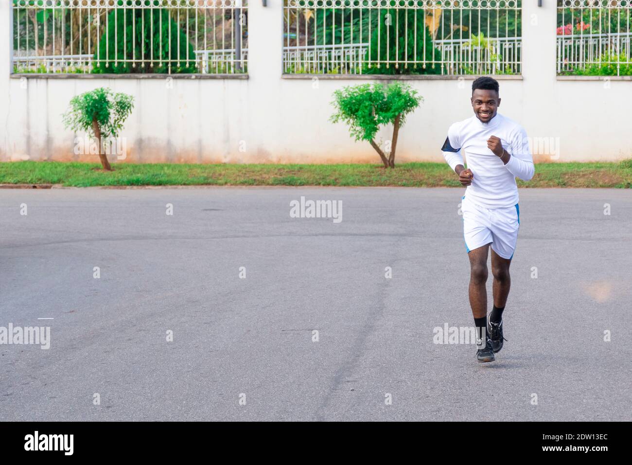 young black african man going for a run on the streets Stock Photo