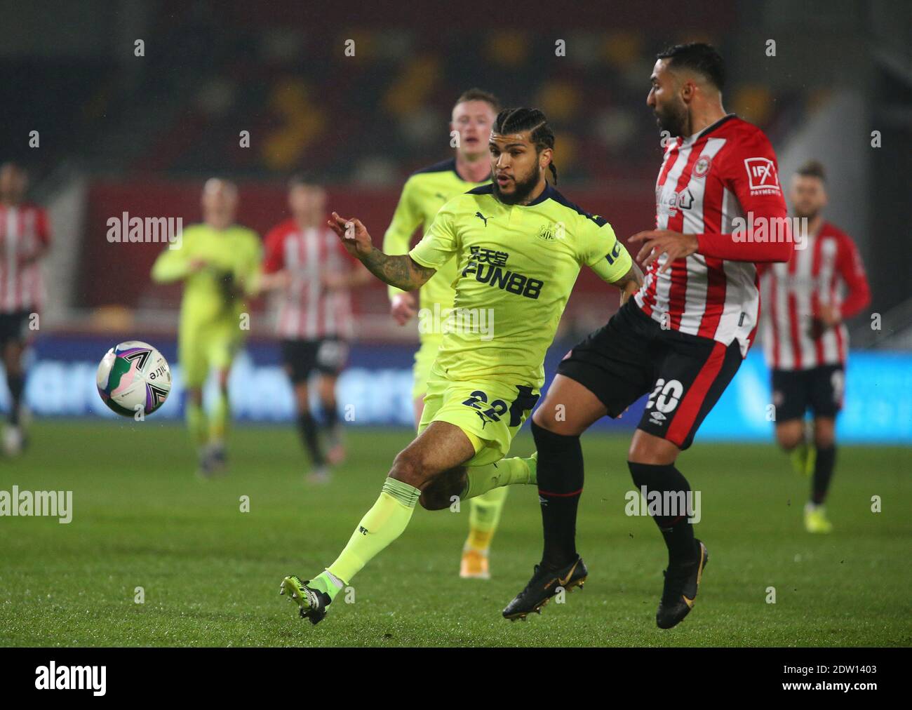 Brentford, UK. 22nd Dec, 2020. Saman Ghoddos (R) of Brentford and DeAndre Yedlin (L) of Newcastle United during the Carabao Cup match at the Brentford Community Stadium, Brentford Picture by Mark Chapman/Focus Images/Sipa USA ? 22/12/2020 Credit: Sipa USA/Alamy Live News Stock Photo