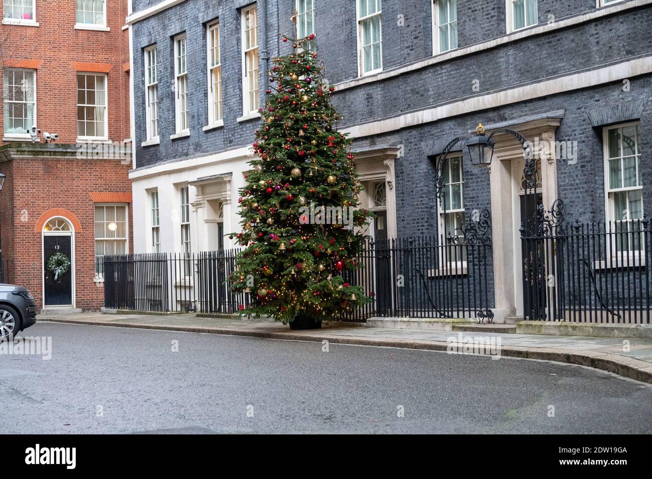 Downing Street, London UK at Christmas, 10, 11 and 12 Downing Street with Christmas tree Stock Photo