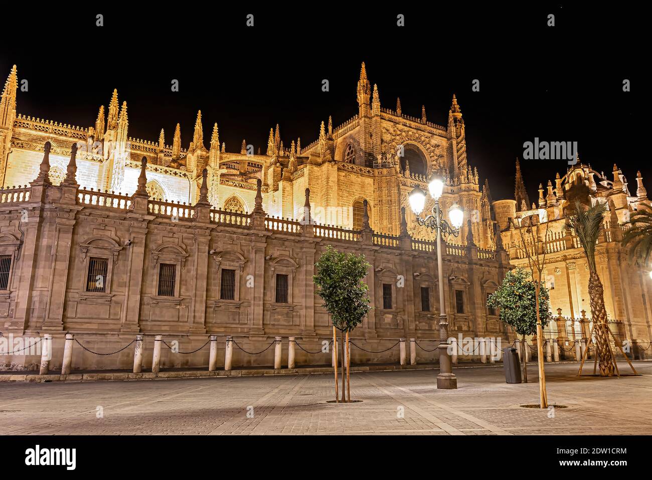Seville Cathedral of Saint Mary of the See (Catedral de Santa Maria de la Sede de Sevilla) illuminated at night Stock Photo