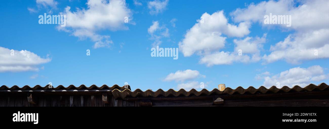 Abstract image of blurred sky. Old roof against the blue sky background. For design, with a space for text Stock Photo