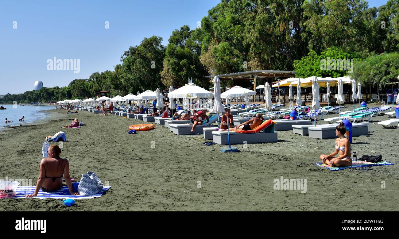 Dasoudi public beach, swimming, sand, ships in distance, Mediterranean sea, Limassol, Cyprus Stock Photo