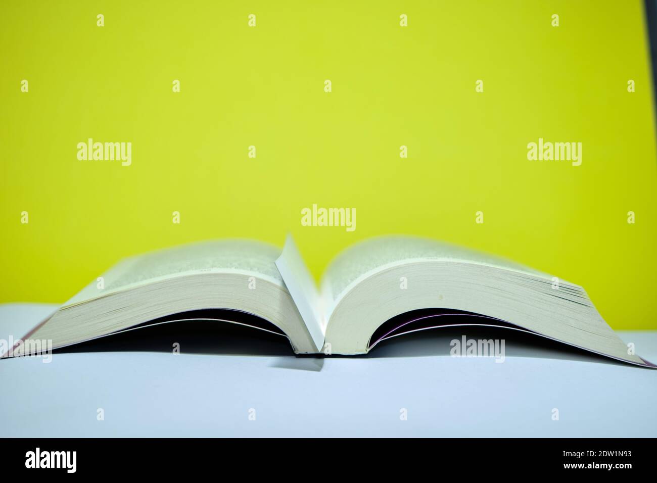 Opened thick book and bookmark in the middle of the book. Isolated ...