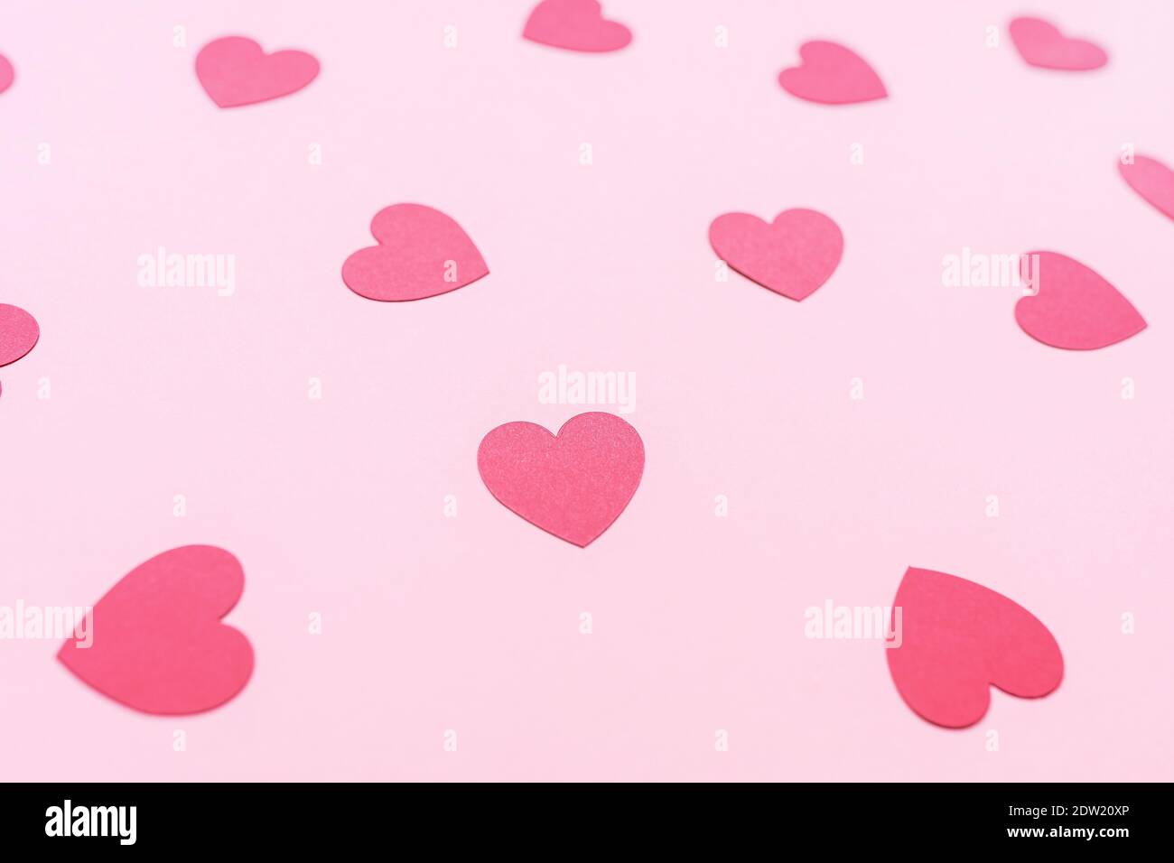 Romantic pink backround with red paper hearts Stock Photo - Alamy