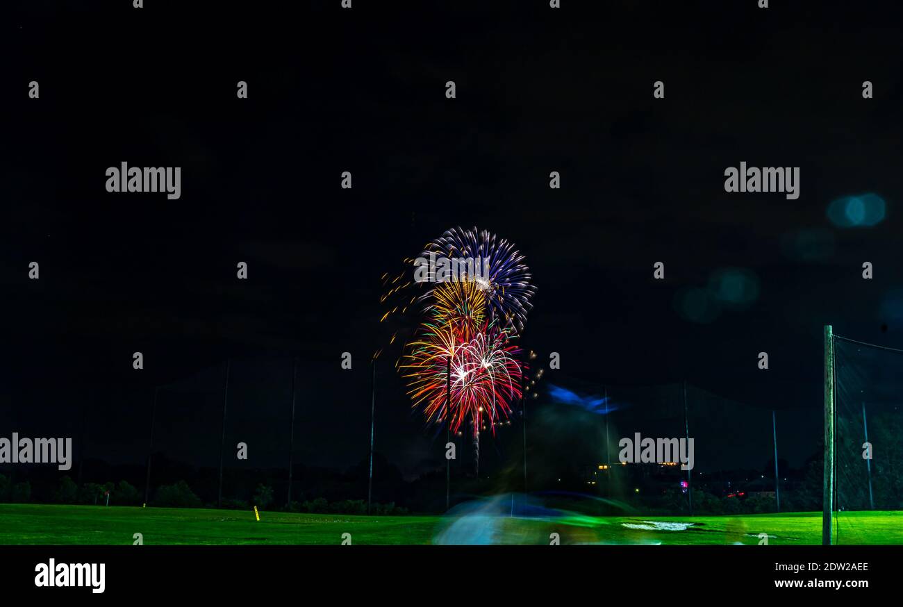 Low Angle View Of Illuminated Fireworks Against Sky At Night Stock Photo