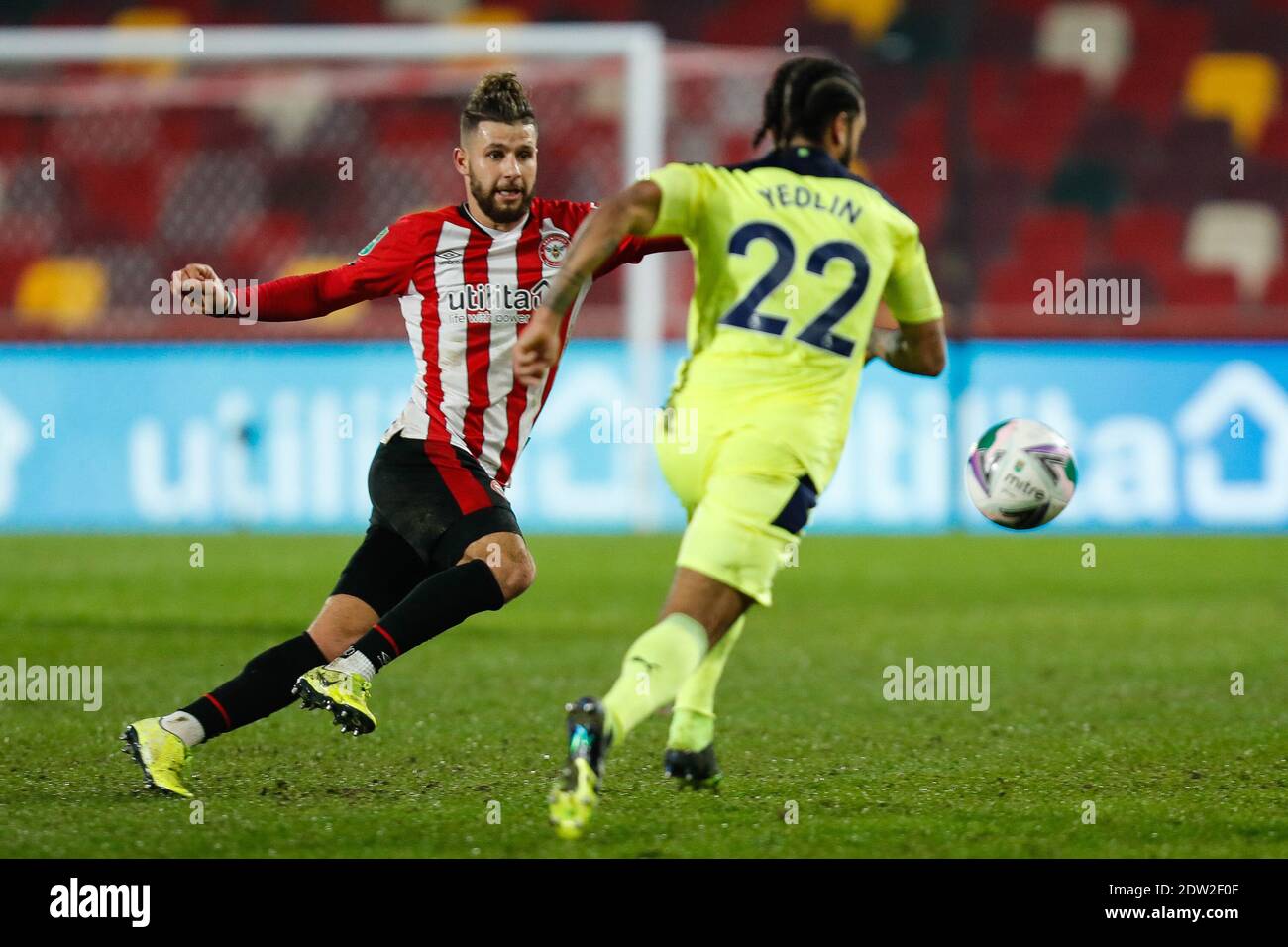 Brentford, UK. 22nd Dec, 2020. Emiliano Marcondes of Brentford and DeAndre Yedlin of Newcastle United during the Carabao Cup Quarter Final match between Brentford and Newcastle United at the Brentford Community Stadium, Brentford Picture by Mark D Fuller/Focus Images/Sipa USA 22/12/2020 Credit: Sipa USA/Alamy Live News Stock Photo