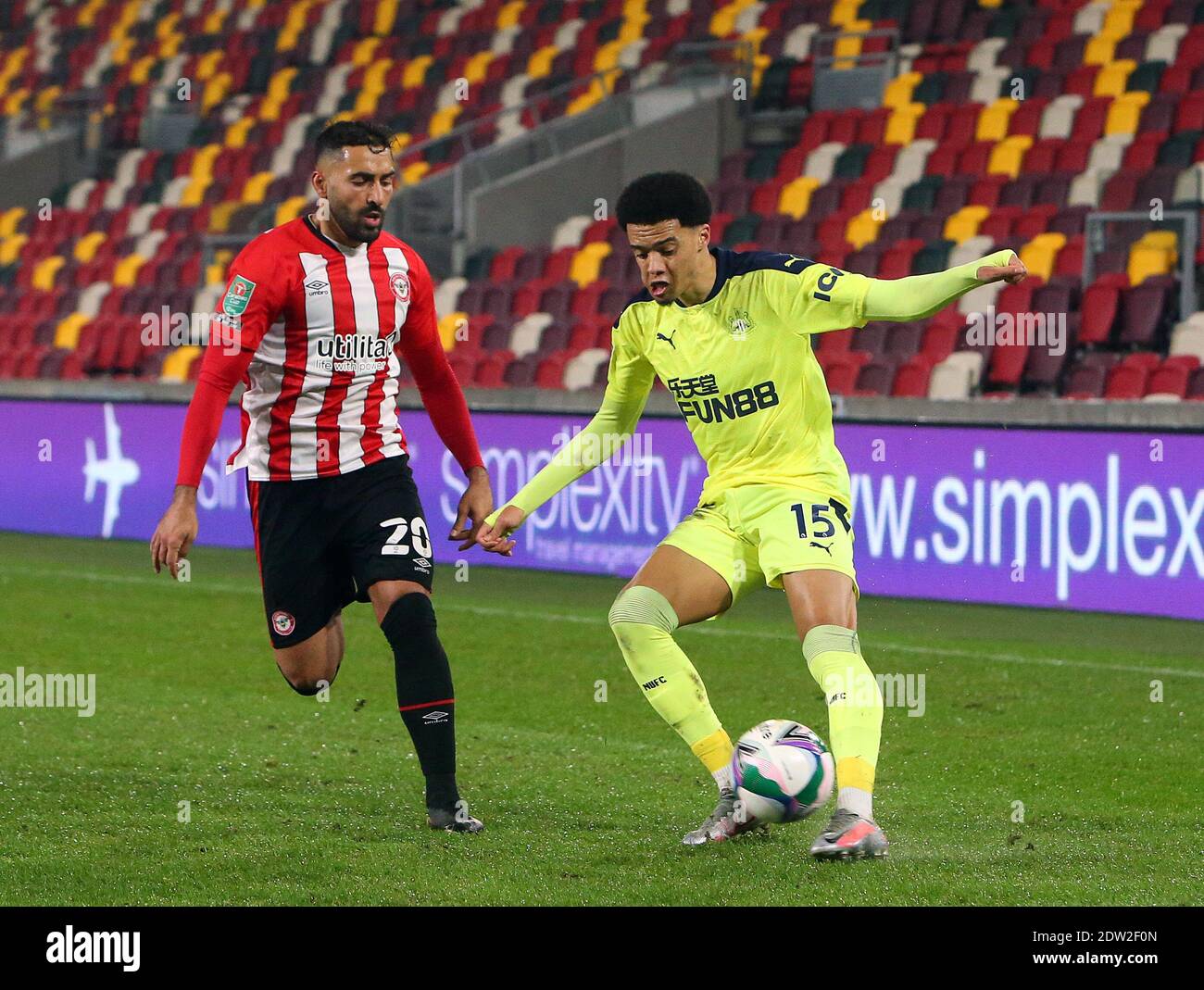 Brentford, UK. 22nd Dec, 2020. Saman Ghoddos (L) of Brentford and Jamal Lewis (R) of Newcastle United during the Carabao Cup match at the Brentford Community Stadium, Brentford Picture by Mark Chapman/Focus Images/Sipa USA ? 22/12/2020 Credit: Sipa USA/Alamy Live News Stock Photo