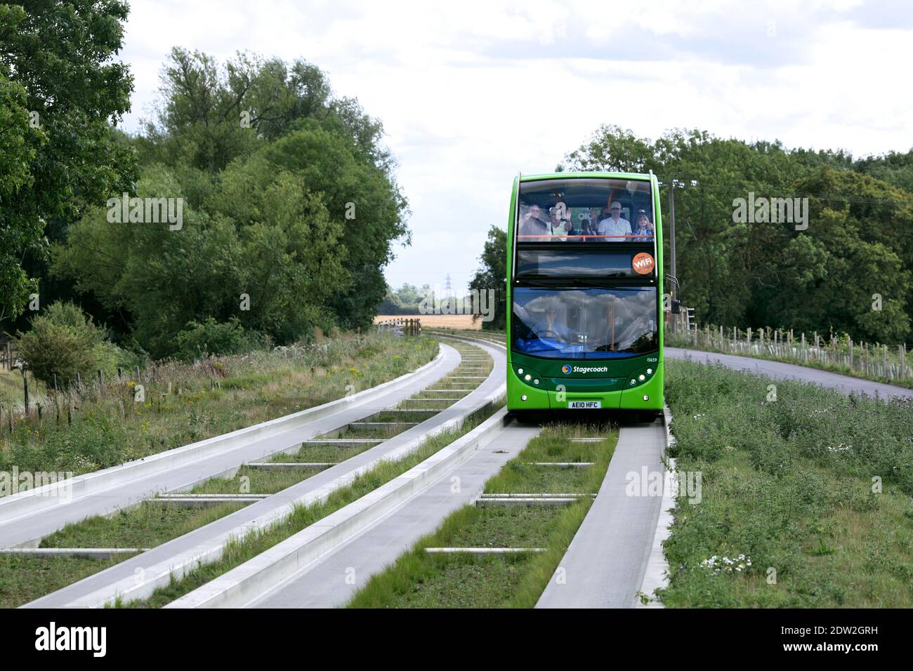 A 100% biodiesel-fuelled double decker bus near Oakington on the guided busway between Cambridge and St. Ives, Cambridgeshire. Stock Photo