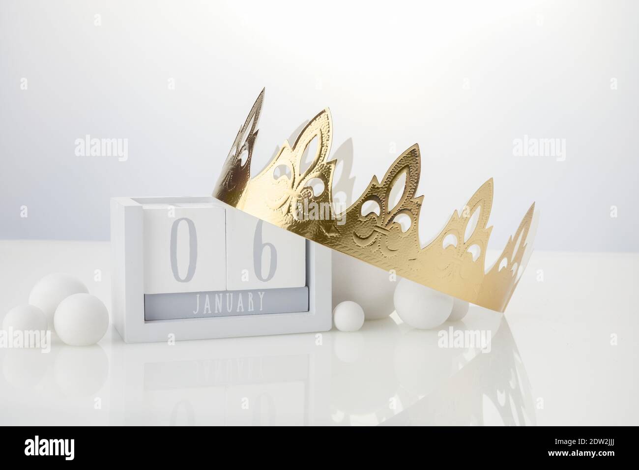 Happy Epiphany day, three kings day. Calendar with king crown on white