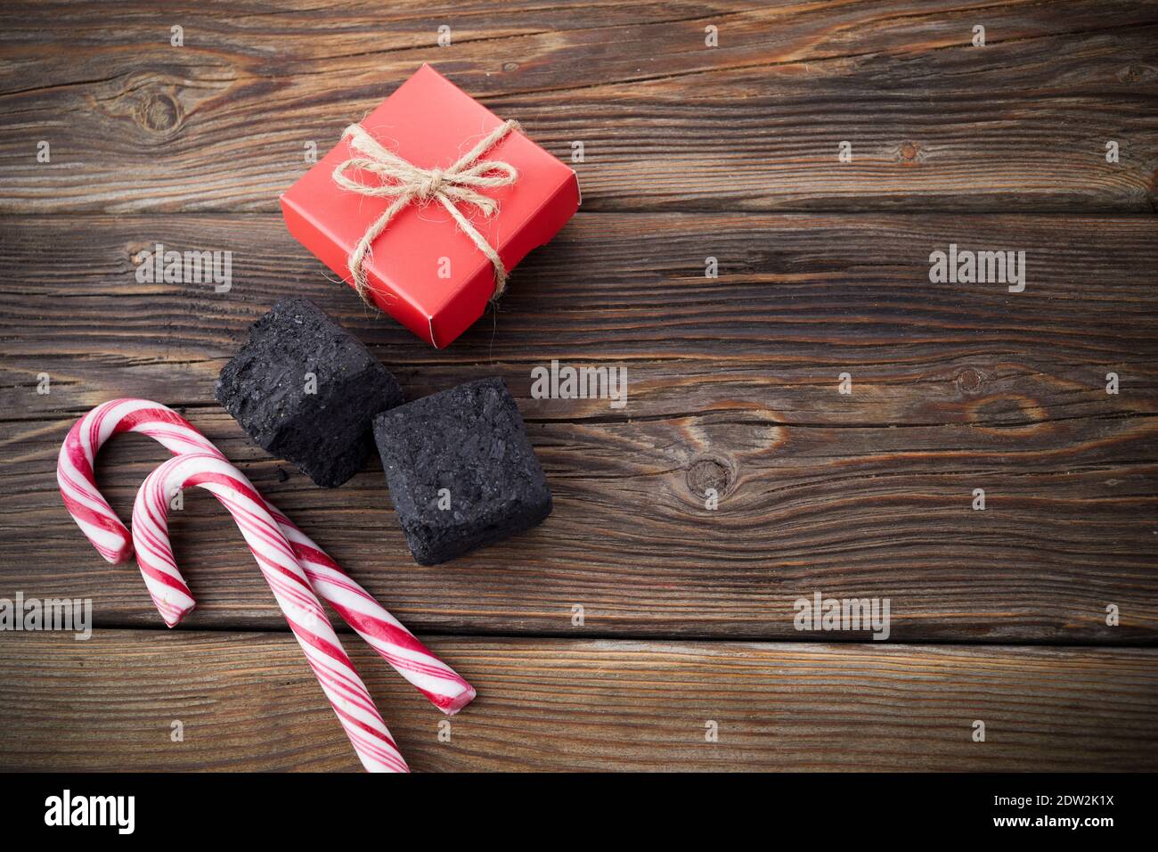 Christmas coal for bad kids and candys or gifts for good children. Christmas tradition in many countries. Stock Photo
