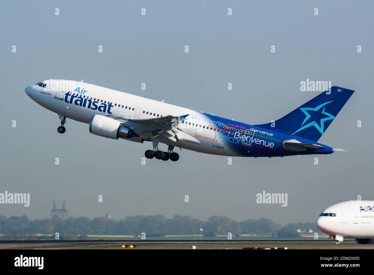 Paris / France - April 24, 2015: Air Transat Airbus A310 C-GFAT passenger plane departure and take off at Paris Charles de Gaulle Airport Stock Photo