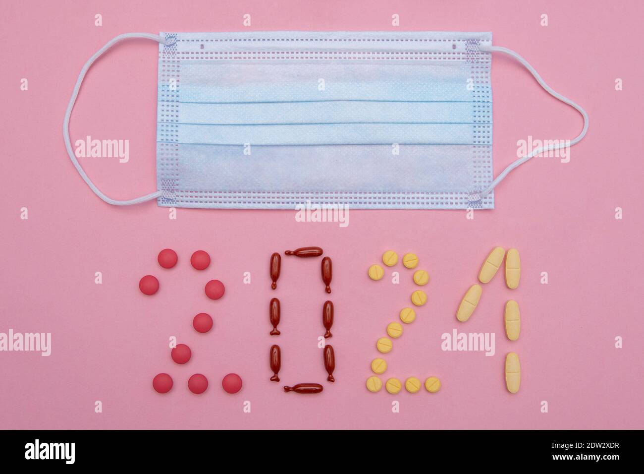 2021 made of pills and surgical mask. Minimal new year concept Stock Photo