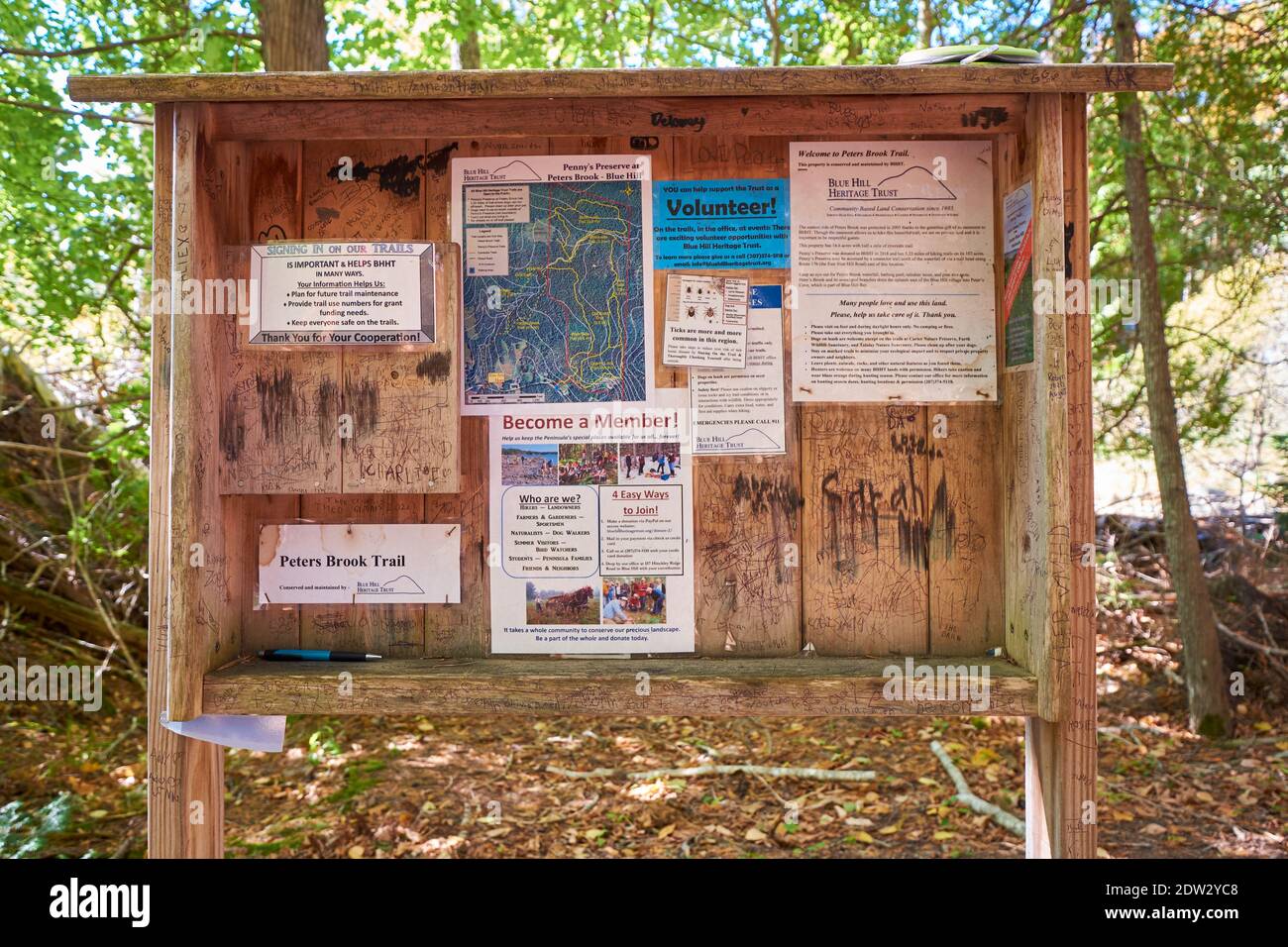 The wood bulletin board for the Peter's Brook Trail, part of the Blue Hill Heritage Trust conservation land. In East Blue Hill, Maine. Stock Photo