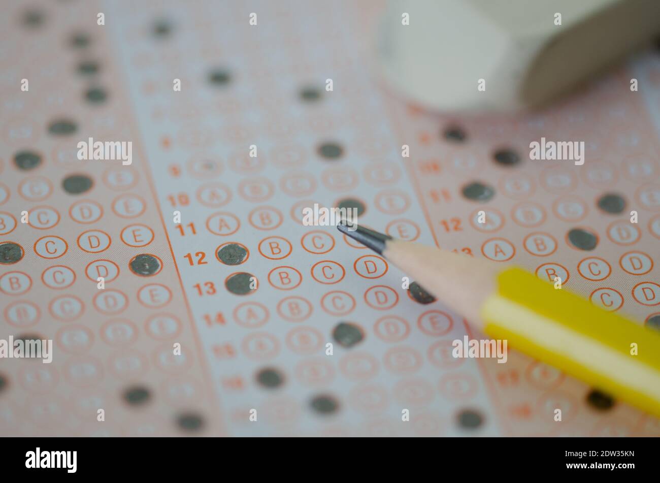 Close up of multiple choice examination form or  optical mark paper and yellow pencil,selective focus, Stock Photo