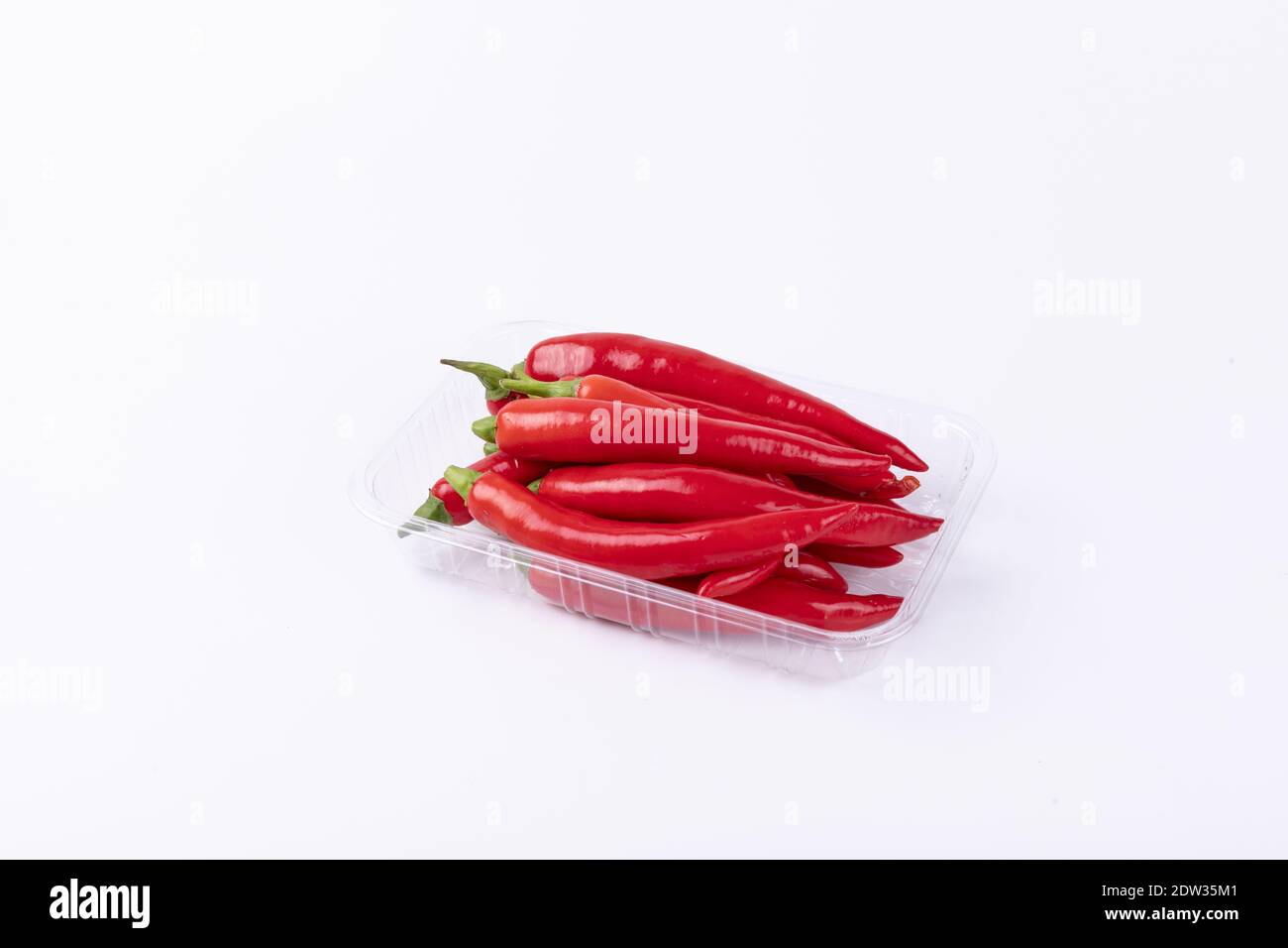 Fresh chili peppers isolated on a white background Stock Photo - Alamy