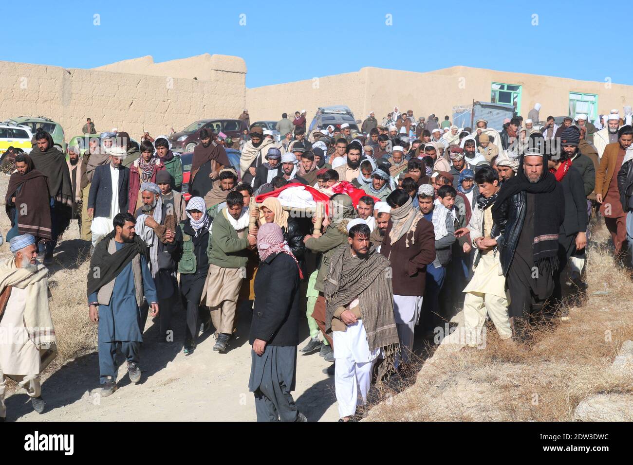 Ghazni, Afghanistan. 22nd Dec, 2020. People attend the funeral of freelance journalist Ramatullah Nikzad in Khoja Omari district of Ghazni province, Afghanistan, on Dec. 22, 2020. Freelance journalist and chairman of Provincial Journalists Association Ramatullah Nikzad was shot by an assailant holding a silenced pistol near his house in Khwaja Hakim, an area in provincial capital Ghazni city on Monday evening, Ahmad Khan Sirt from Ghazni police told Xinhua. Credit: Rohullah/Xinhua/Alamy Live News Stock Photo