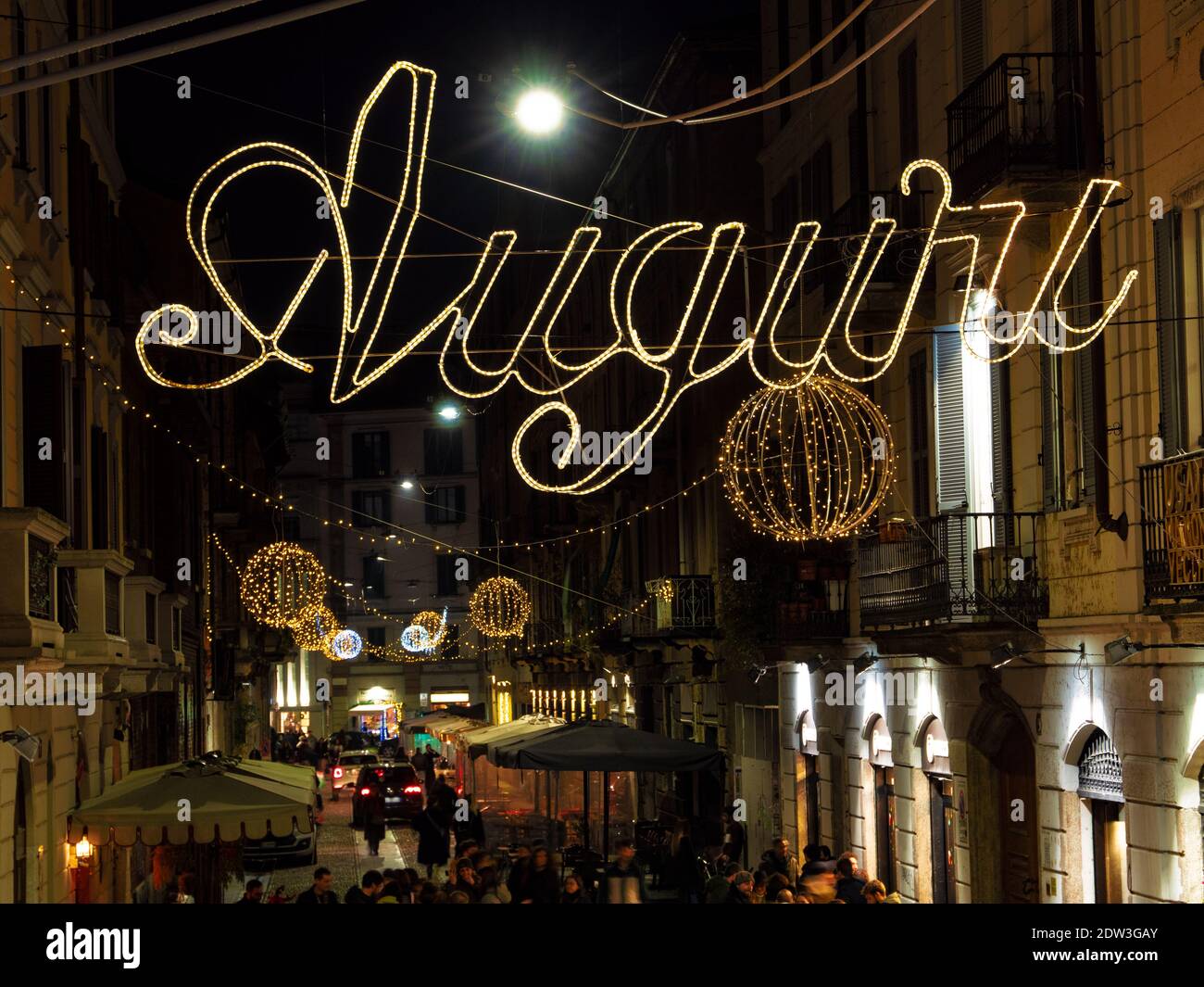 Greetings messages light up the streets of Milan during the Christmas holidays.Lombardy, Italy. Stock Photo