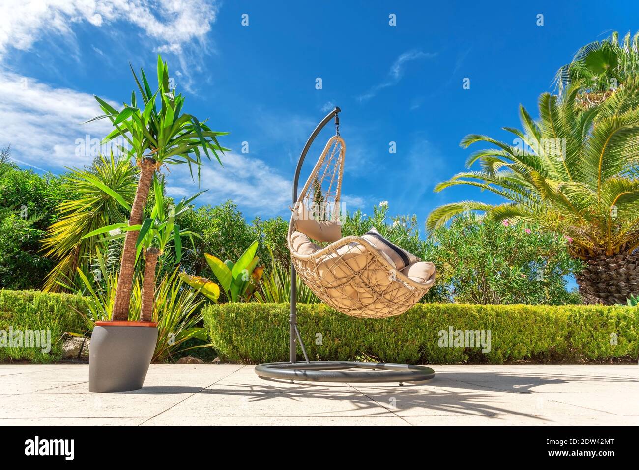 Suspended swing chair for relaxing in a luxury garden, bottom view with