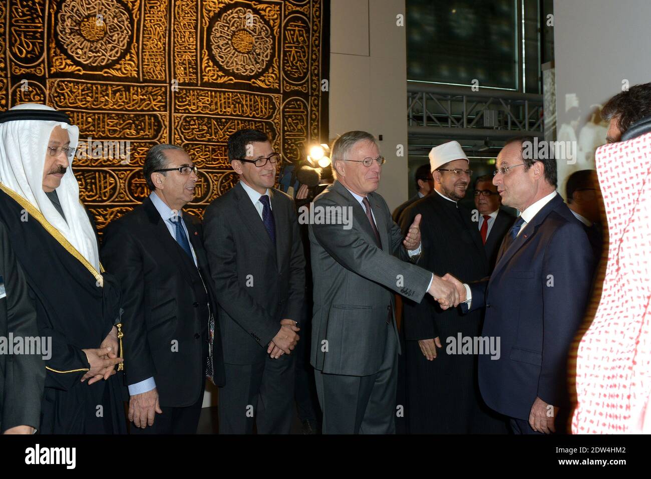 French president Francois Hollande (right) seen with Total Honorary Chairman Thierry Desmarest as he inaugurates an exhibition about the 'hajj' or 'pilgrimage' at the Institut du Monde Arabe in Paris, France, on April 22, 2014. It will stay until the end of August 2014. Photo by Ammar Abd Rabbo/ABACAPRESS.COM Stock Photo