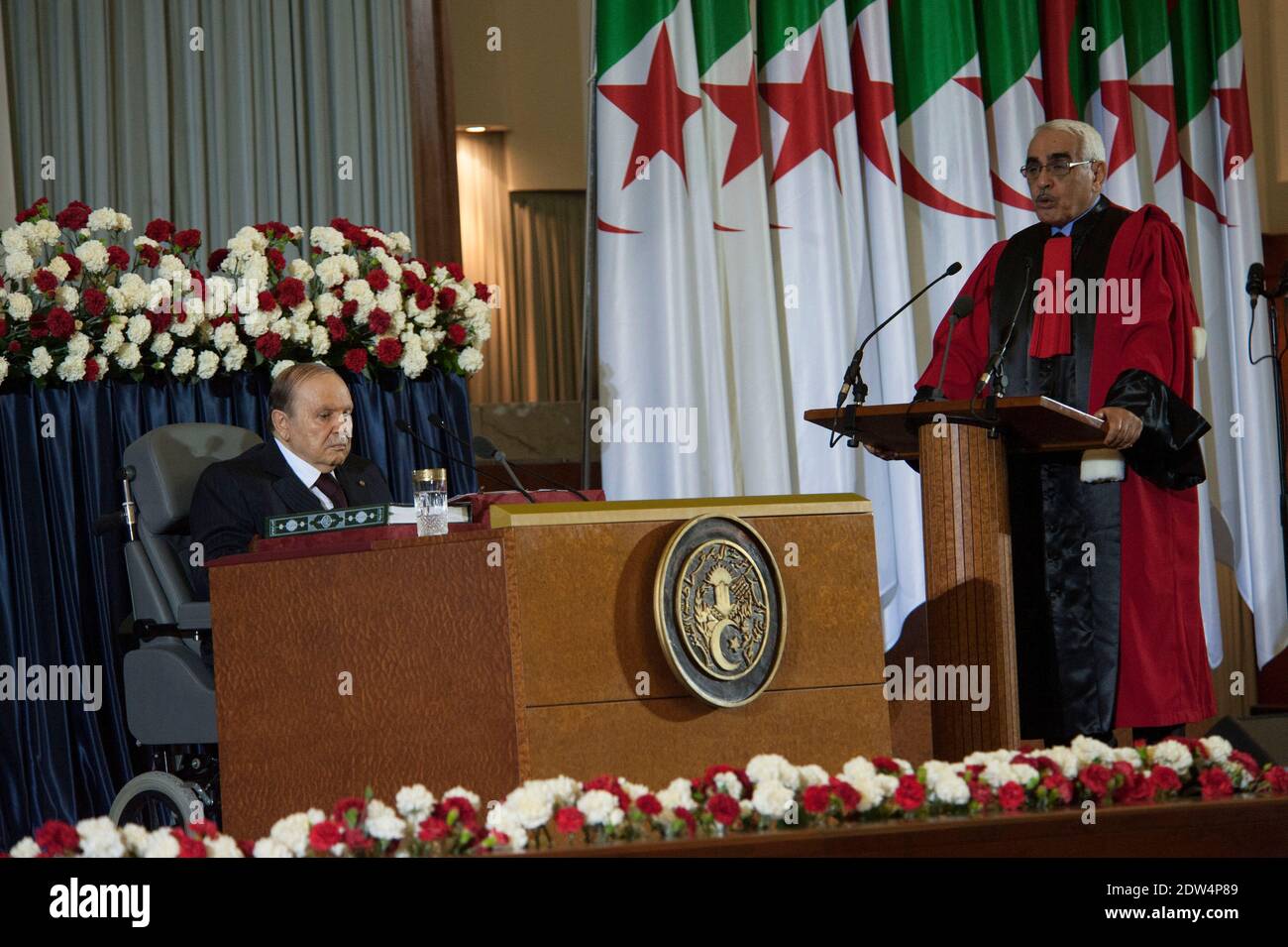 Algerian President Abdulaziz Bouteflika sits in his wheelchair on stage during his inauguration ceremony as he is sworn as Algeria's President for a fourth term in Algiers, Algeria, on April 28, 2014. Official results showed that Bouteflika won 81.5 percent of the votes in an election marred by low turnout and claims of fraud by his opponents, including main rival Ali Benflis, who received just 12.18 percent. Photo by Ammi Louiza/ABACAPRESS.COM Stock Photo