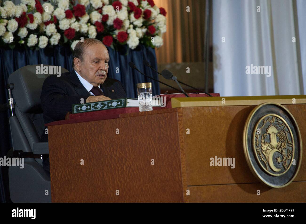 Algerian President Abdulaziz Bouteflika sits in his wheelchair on stage during his inauguration ceremony as he is sworn as Algeria's President for a fourth term in Algiers, Algeria, on April 28, 2014. Official results showed that Bouteflika won 81.5 percent of the votes in an election marred by low turnout and claims of fraud by his opponents, including main rival Ali Benflis, who received just 12.18 percent. Photo by Ammi Louiza/ABACAPRESS.COM Stock Photo
