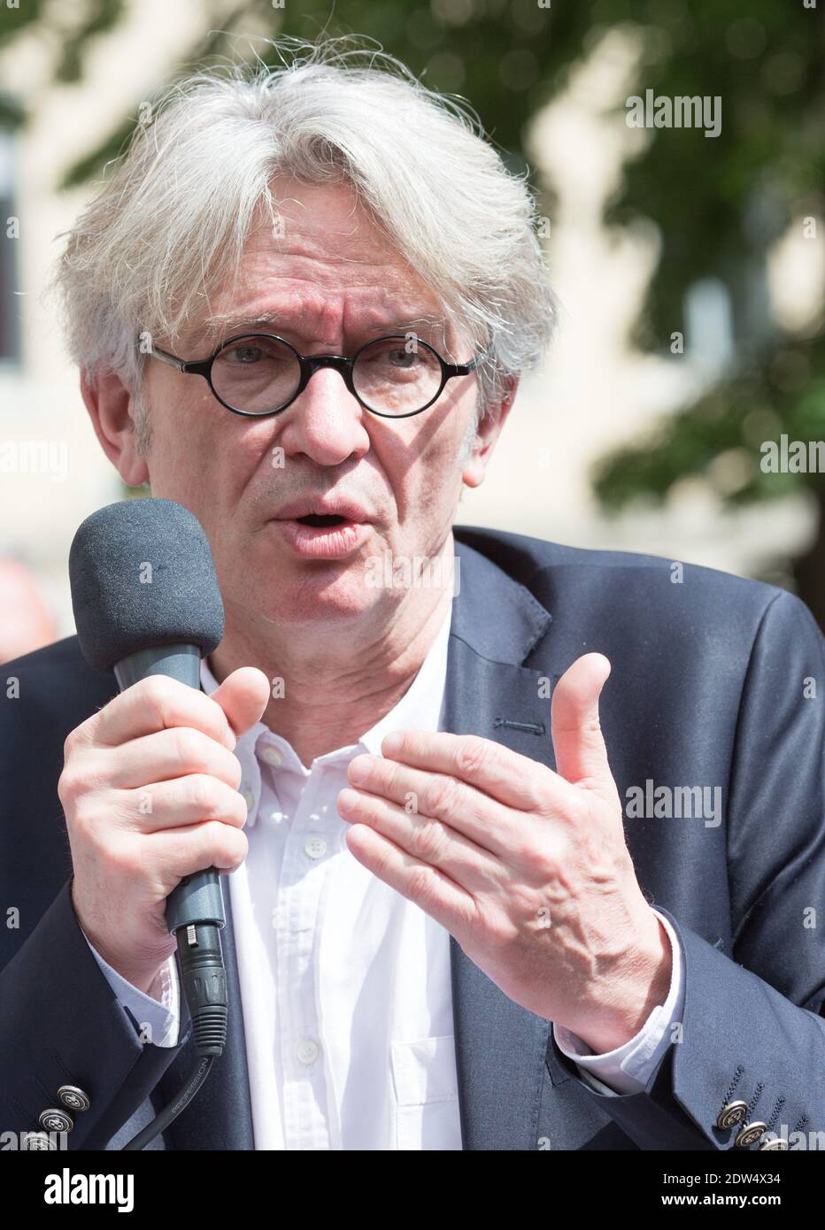 Jean-Claude Mailly, general secretary of the FO union (Force Ouvriere -  Workers' Force) speaks to journalists as part of the FO May Day Rally in  Lyon, central-eastern France on May 1, 2014.