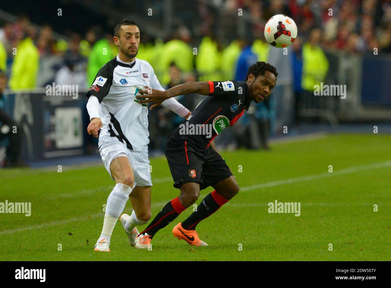Rennes's Jean II Makoun battling Guingamp's Jonathan Martins Pereira during  the French Cup Final soccer match, Rennes vs Guingamp in Stade de France,  St-Denis, France, on May 3rd, 2014.Guingamp won 2-0. Photo