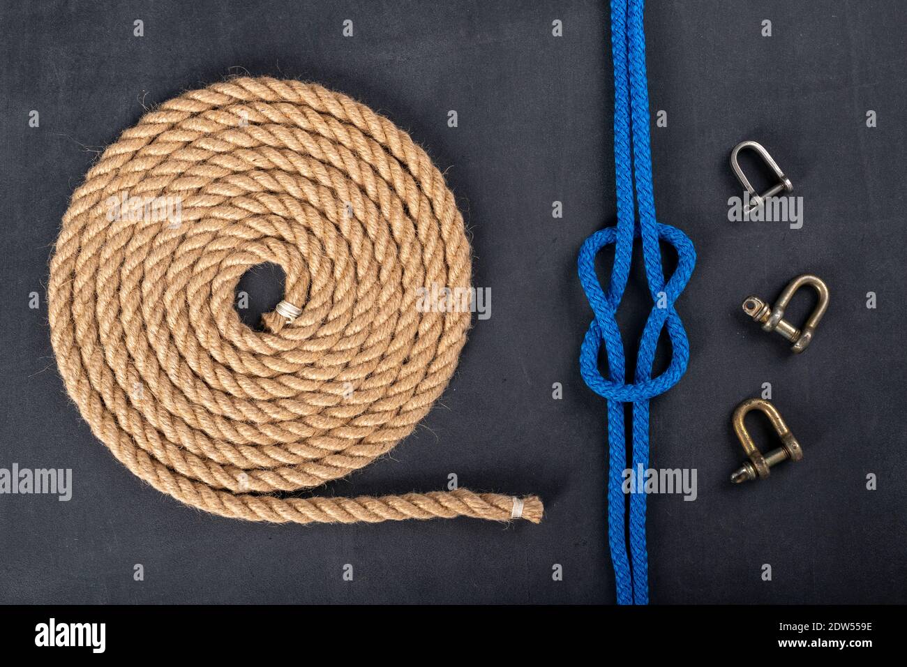 Thick jute rope coiled in the shape of a circle, shackles and a