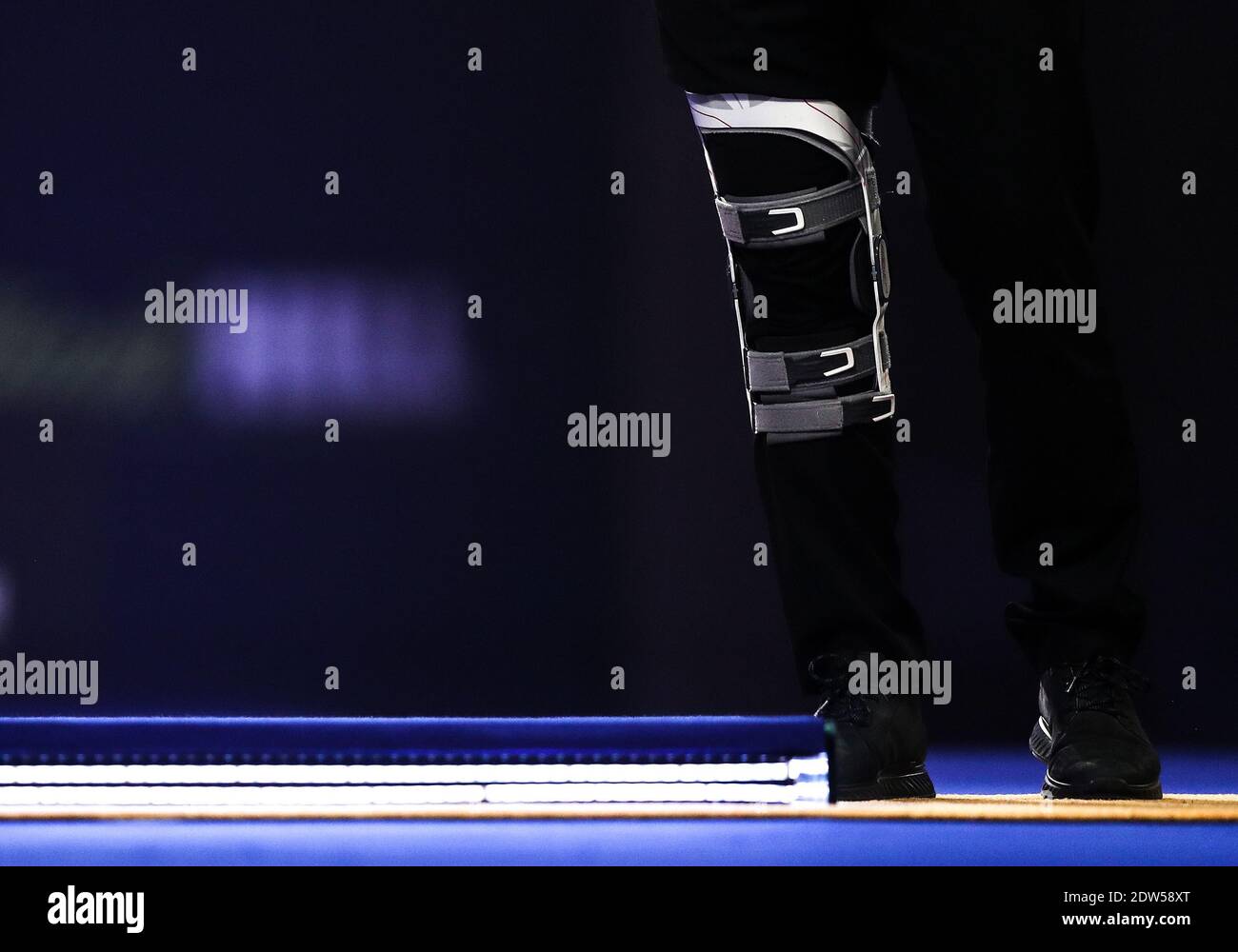 General view of Dimitri Van den Bergh's leg brace at the oche during day eight of the William Hill World Darts Championship at Alexandra Palace, London. Stock Photo